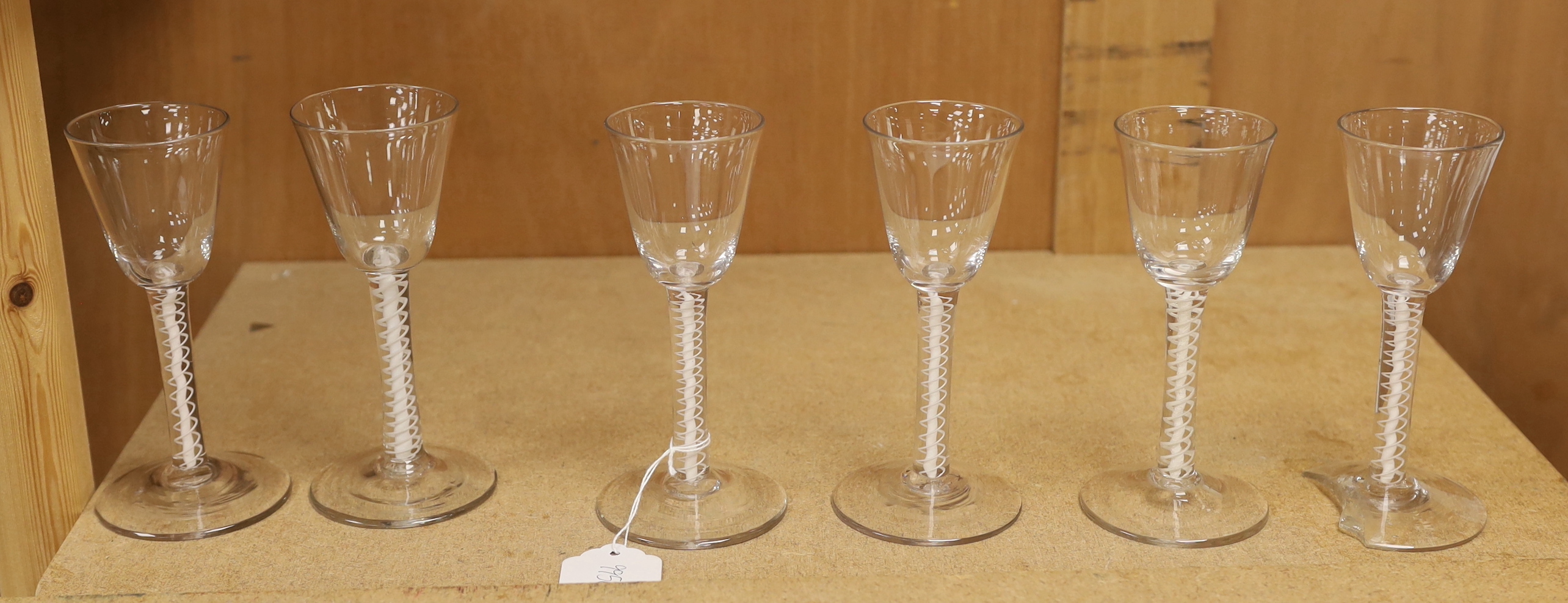 A set of six mid 18th century opaque twist stemmed wine glasses (one a.f.)